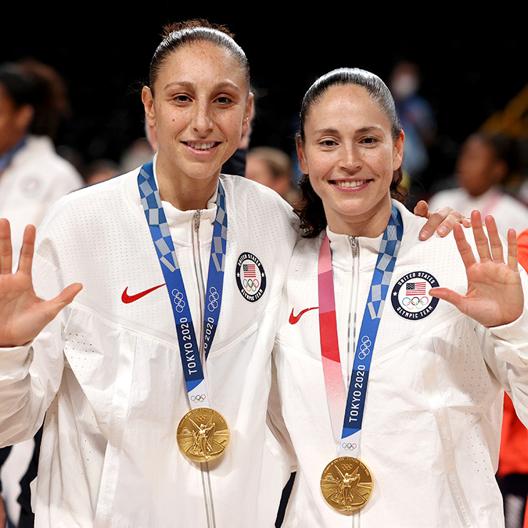 Five-time Olympic gold medalists Diana Taurasi and Sue Bird celebrate with their gold medals at the presentation ceremony in Women's Basketball.