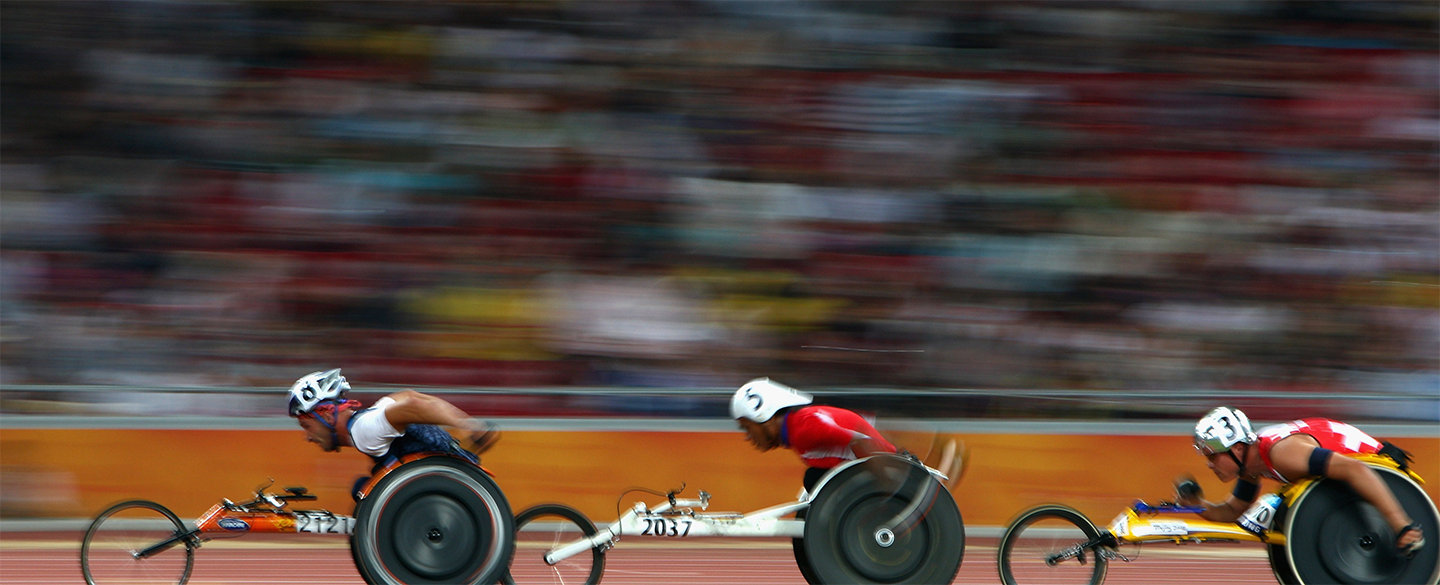 Paralympic racers in-motion on the track at the Tokyo 2020 Paralympic Games.