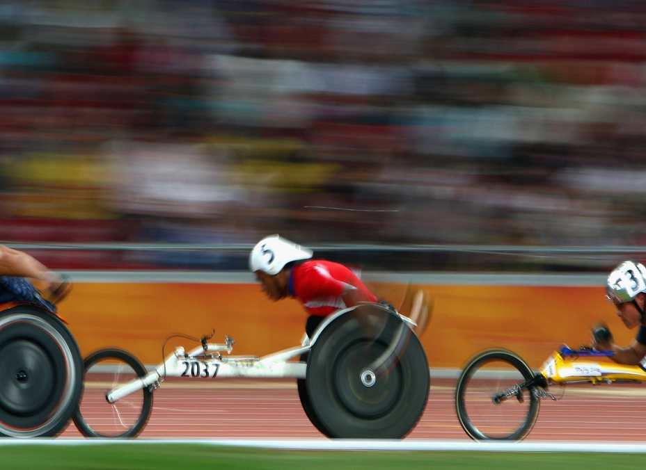 Racers in motion at the Paralympic Games.